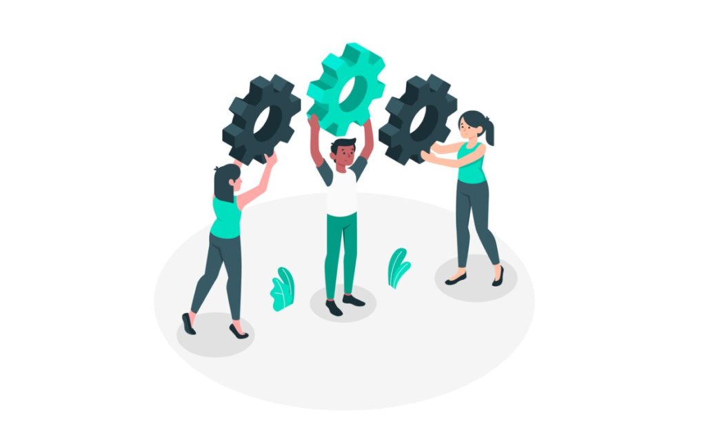 Three people holding up large gear cogs on a white background