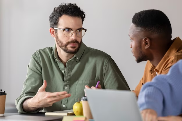 Two individuals engaged in a discussion